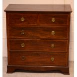 A George III mahogany chest of two short over three long drawers, satinwood and ebony inlaid,