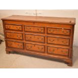 An early 19th century oak and mahogany cross-banded blanket chest with six faux drawers over three