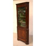 A Georgian mahogany floor-standing corner display cabinet,