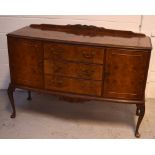 A mid-20th century burr walnut sideboard of cupboards and drawers in the Epstein style,