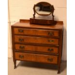 A Georgian mahogany four-drawer chest of drawers on turned supports terminating in castors and a