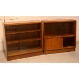 Two mid-20th century bookcases; one with glazed sliding doors over wooden doors, width 91cm,