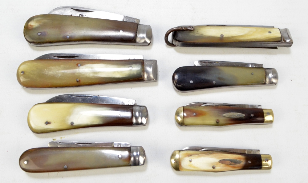 A collection of five early 20th century horn bodied single bladed pen knives including examples by