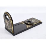 A black lacquer bookslide decorated with mother of pearl set birds and flowers with gilt foliage