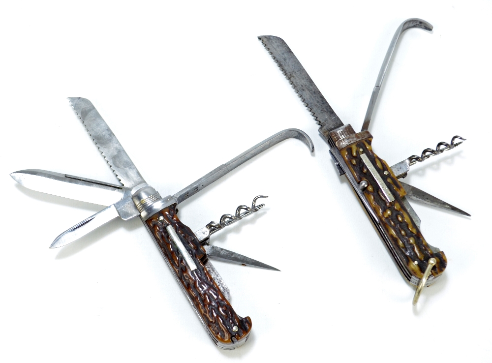 Two late 19th/early 20th century stag horn bodied steel bladed multi tool pocket knives,