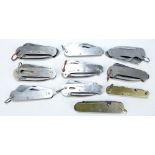 A group of mid-20th century clasp knives, the majority with two blades and hinged spike,