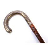 An early 20th century hallmarked silver handled bamboo walking cane, the handle engraved '1902',