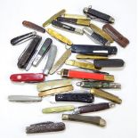 A collection of thirty-one various pen knives including a single bladed marble effect bodied