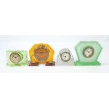 Three Art Deco style glass timepieces and a further plastic amber coloured example (4).