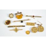 A Chinese yellow metal two sectioned pierced brooch (lacking pin), four bar brooches,