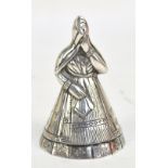 A mid-20th century Peruvian 925 silver figural bell modelled as a woman in a traditional clothes,