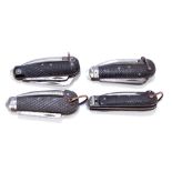 Four military clasp knives with moulded checkered pattern bodies with single blade,