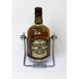 A 1.75l bottle of 'Chivas Regal 12 Year Old Scotch Whisky' in a specially designed decanting cradle.