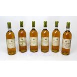 Six bottles of Château Roumieu Sauternes 1983 dessert wine,