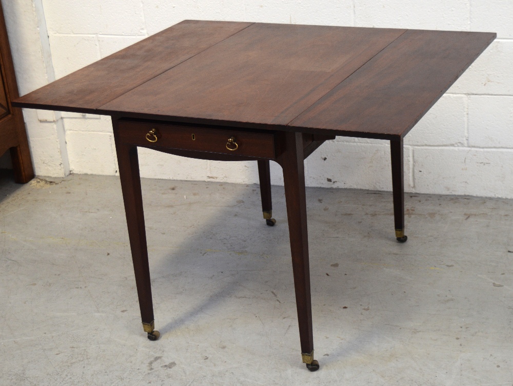 A 19th century mahogany single-drawer Pembroke table raised on tapering square supports,