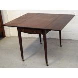 A 19th century mahogany single-drawer Pembroke table raised on tapering square supports,