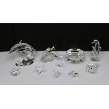 A collection of boxed Swarovski crystal sea creatures to include dolphin, clam, two puffer fish,