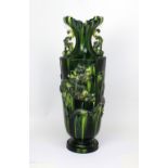 An early 20th century Burmantoft large hexagonal green drip glaze vase with flared neck,