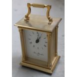 A 20th century Robert Blandford brass carriage clock, the white dial set with Roman numerals,