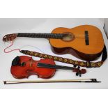 A full-sized modern Chinese Skylark violin, cased with bow, also a Tatra classic guitar (2).