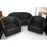 A faux leather three-piece suite comprising a two-seat tub sofa on wooden supports and two matching