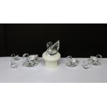 A collection of boxed Swarovski crystal swans (7).