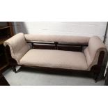 A Victorian mahogany three-seat sofa with carved backrail to curved carved sides,