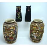 A pair of early-to-mid 20th century Japanese baluster vases with figural decoration in relief,