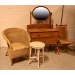 An Edwardian oak oval mirror-back dressing table, two drawers over one long drawer,