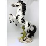 A decorative Italian ceramic figure of a rearing horse, height 96cm.