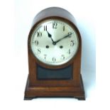 An early 20th century mahogany-cased eight-day mantel clock, silvered dial set with Arabic numerals.