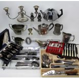 A quantity of plated ware to include candlesticks, teapots etc.