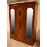 An Edwardian mahogany two mirror door wardrobe,