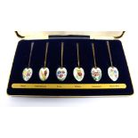 A cased set of six Elizabeth II hallmarked silver gilt coffee spoons,