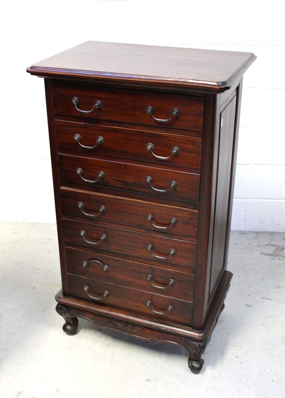 A reproduction seven-drawer chest on squat cabriole supports height 112cm.