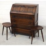 A Priory oak bureau with fall-front above four drawers, width 76cm and two Ercol-style stools (3).