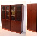 Two modern glazed bookcases and a two-door cupboard (3).