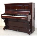 A contemporary mahogany-cased Haake upright piano.