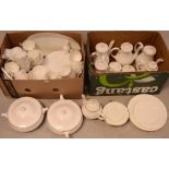 A quantity of gold-rimmed tea and dinner ware to include dinner plates, small plates, cups,