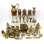 A quantity of brass items to include chamber sticks, bells, vases, jugs etc, some of Eastern design.