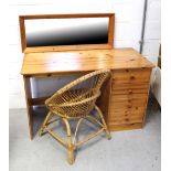 A pine dressing table on slab supports with four drawers to one side,