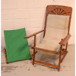 A vintage wooden-framed deckchair and a vintage wooden bed rest (2).