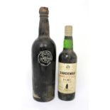 A bottle of Château Lamothe 1934 dessert wine and a half bottle Sainte-Croix-du-Mont 1919 (2).