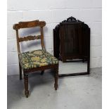 An Edwardian walnut dining chair with carved backrail and front turned supports and an early 20th