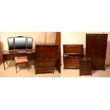 A Stag Minstrel mahogany seven-piece bedroom suite comprising wardrobe, dressing table with stool,