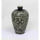 A Julia Carter Preston black and white baluster vase with floral sgraffito decoration and black