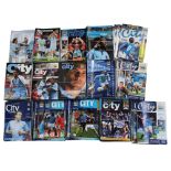 A quantity of Manchester City Football Club programmes.