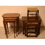 A reproduction walnut nest of tables on cabriole supports,