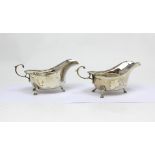 A pair of Elizabeth II hallmarked silver sauce boats, Walker & Hall, Sheffield 1957,