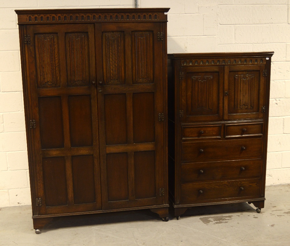 A Priory oak twin-door wardrobe, each door with six recessed panels,